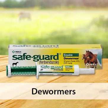 Safe-Guard dewormer packaging on a wooden surface with a blurred natural background