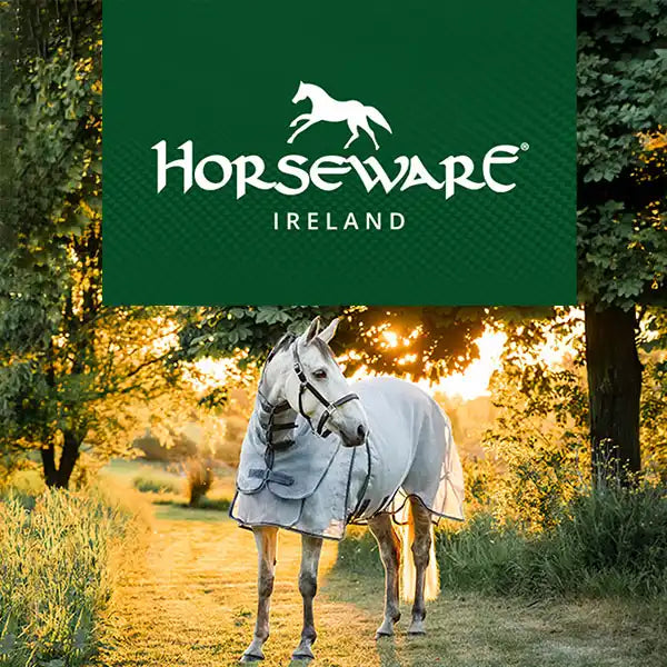 Horse wearing a flysheet with horseware branding