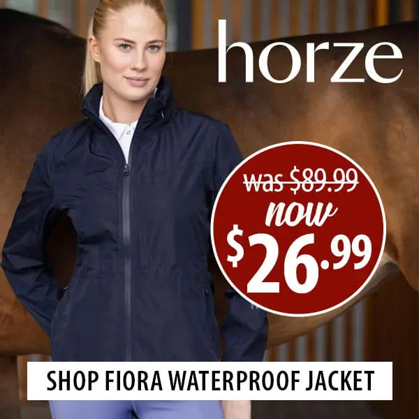 Woman wearing a navy waterproof jacket with promotional text for the Horze Fiora jacket now $26.99