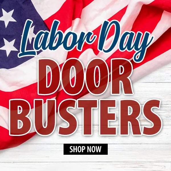 Promotional graphic for Labor Day Door Busters with large red and blue text over a waving American flag and white wood background, plus a black 'SHOP NOW' button.