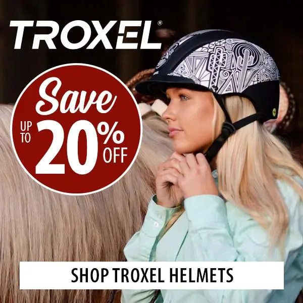 A woman wearing a black and white patterned Troxel equestrian helmet, standing next to a horse. The image features a red promotional badge that says 'Save Up to 20% Off' and a white banner at the bottom that reads 'SHOP TROXEL HELMETS'.