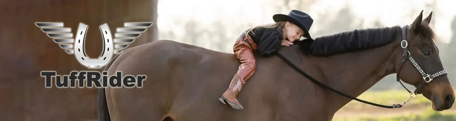 Child on a horse with TuffRider branding in the background